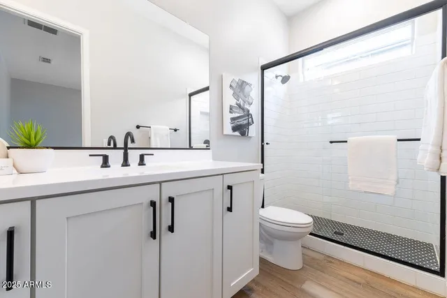 an empty room with windows and closet