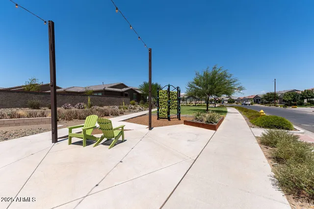 a view of a park with iron fence