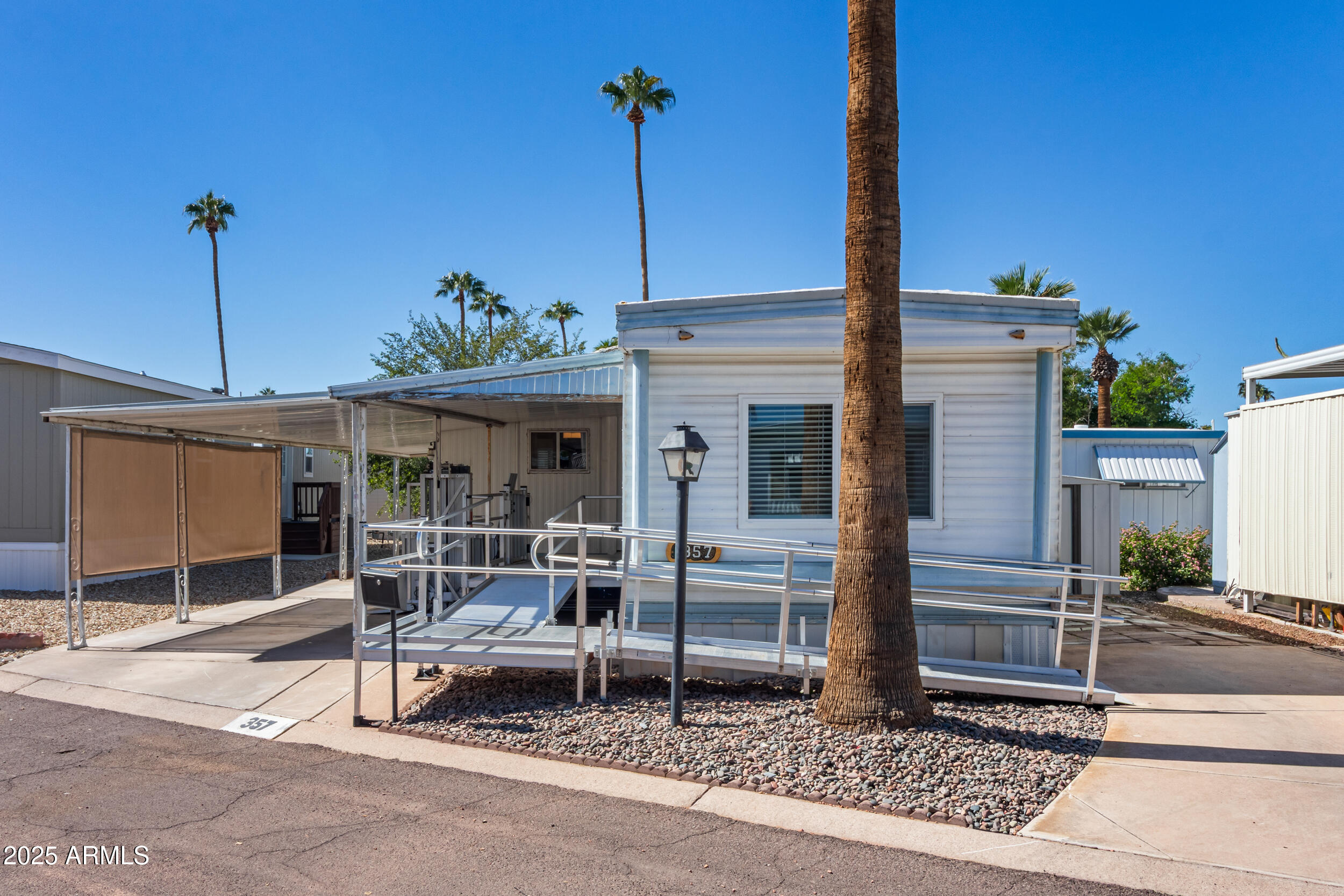 701 South Dobson Road, Unit 357 Mesa, AZ 85202 - Photo 26 of 66 a view of a patio with a table and chairs