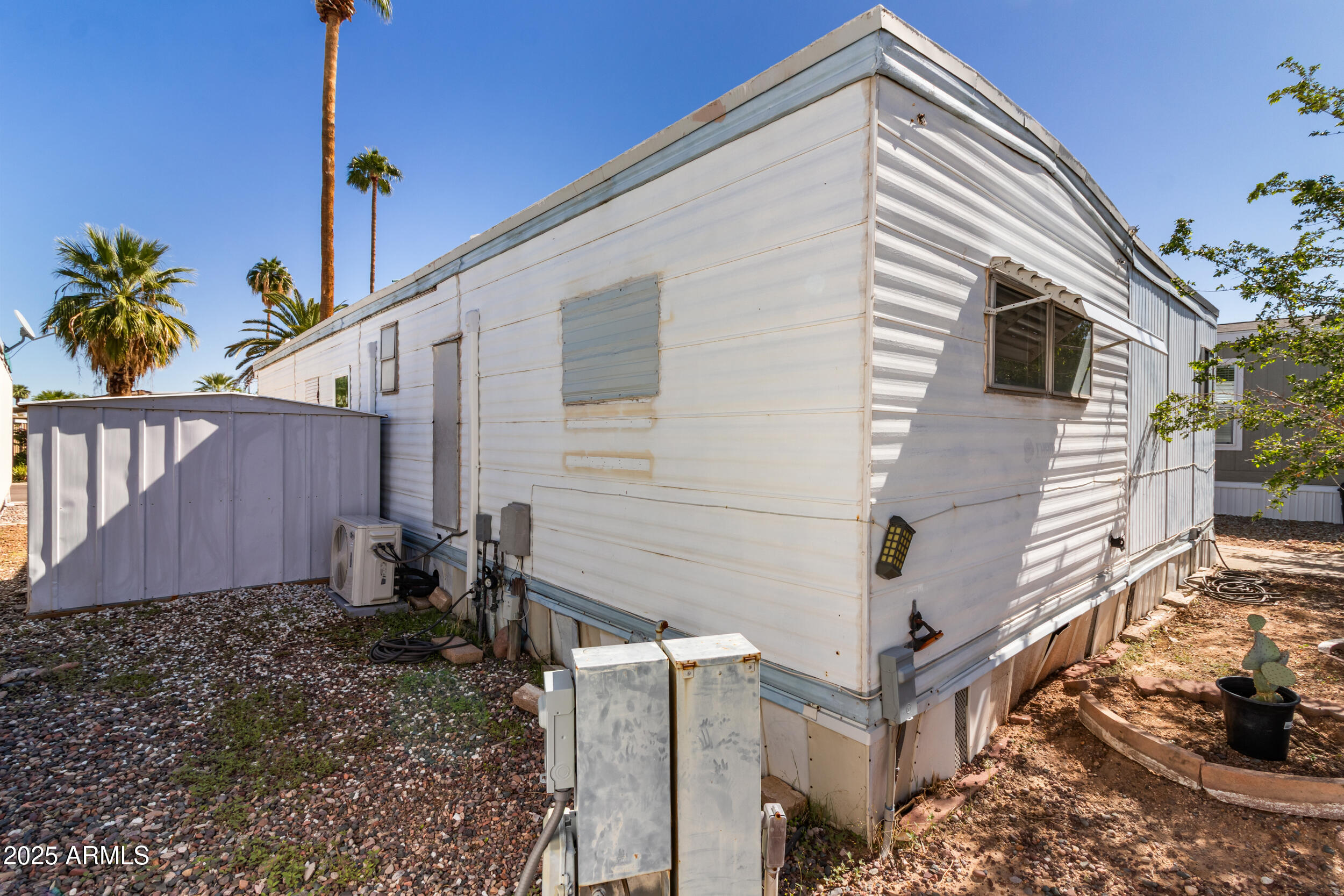 701 South Dobson Road, Unit 357 Mesa, AZ 85202 - Photo 30 of 66 a view of a house with a yard