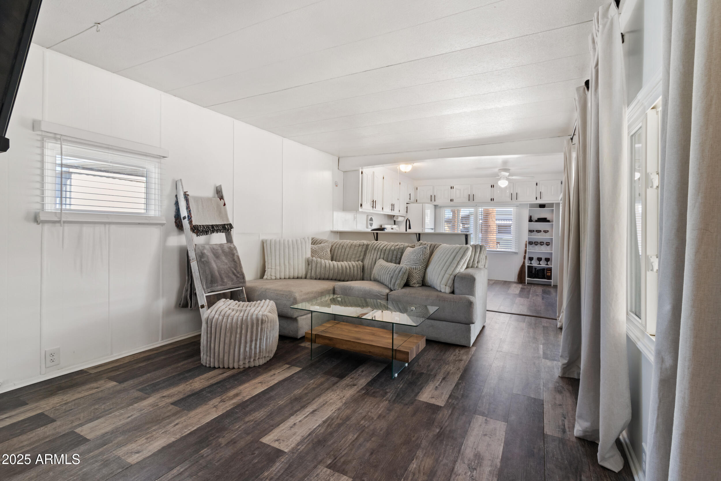 701 South Dobson Road, Unit 357 Mesa, AZ 85202 - Photo 3 of 66 a living room with furniture and a fireplace