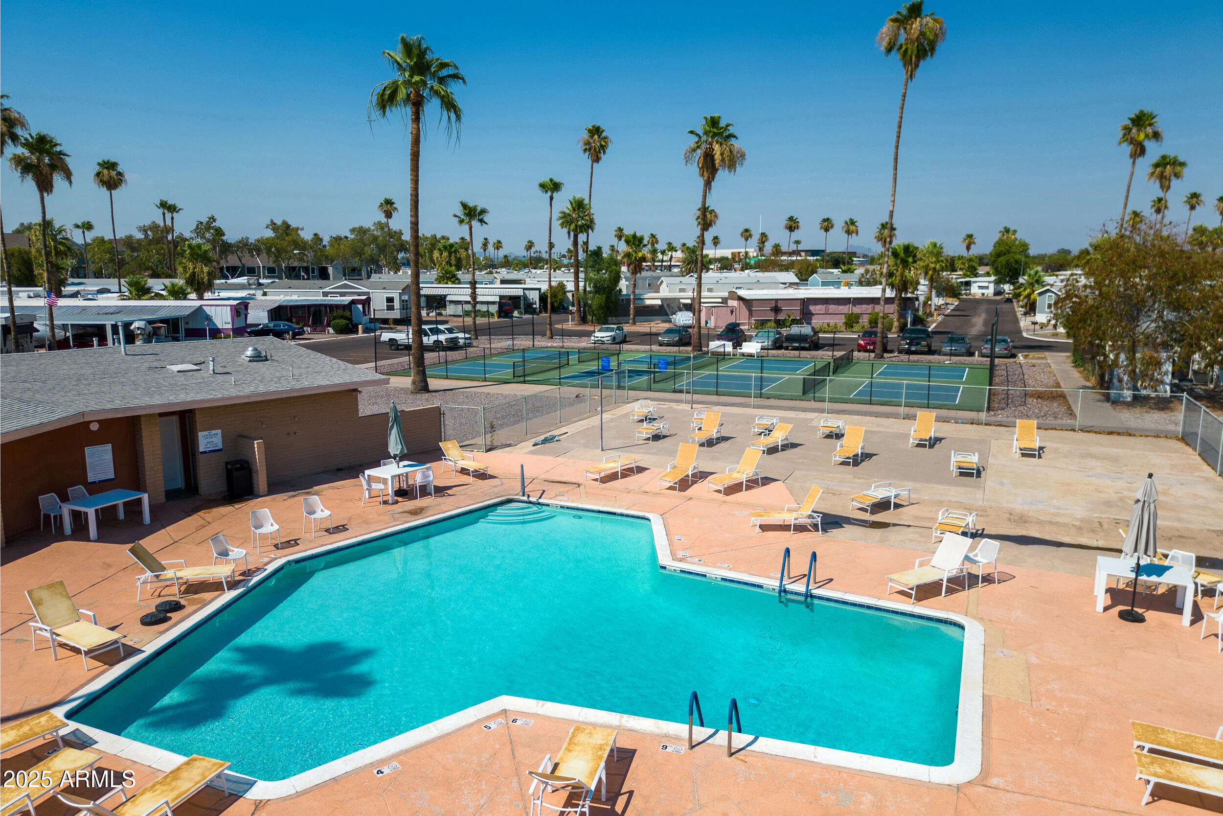 701 South Dobson Road, Unit 357 Mesa, AZ 85202 - Photo 39 of 66 a view of a swimming pool with a yard