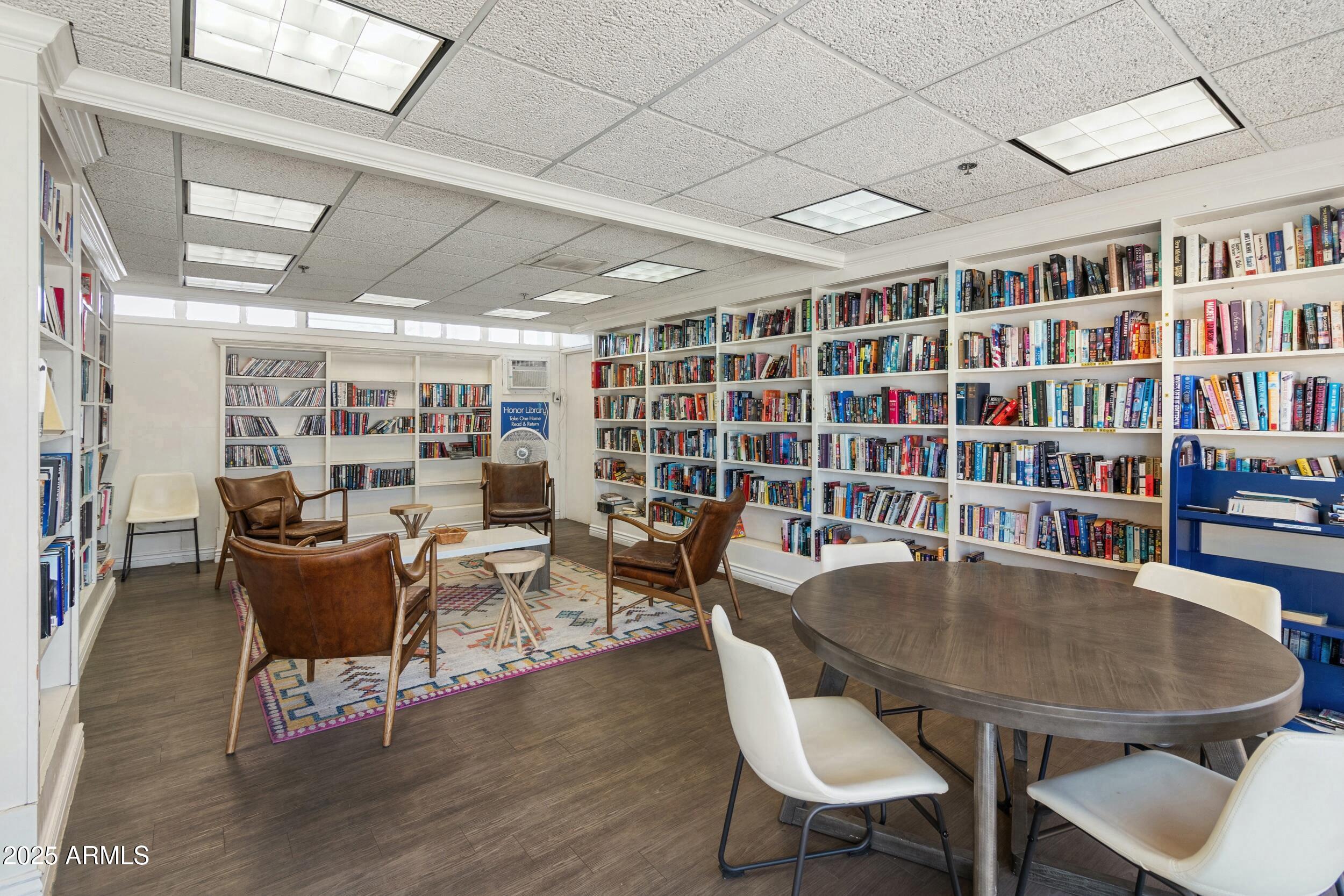 701 South Dobson Road, Unit 357 Mesa, AZ 85202 - Photo 47 of 66 a view of a dining room with furniture and a book shelf