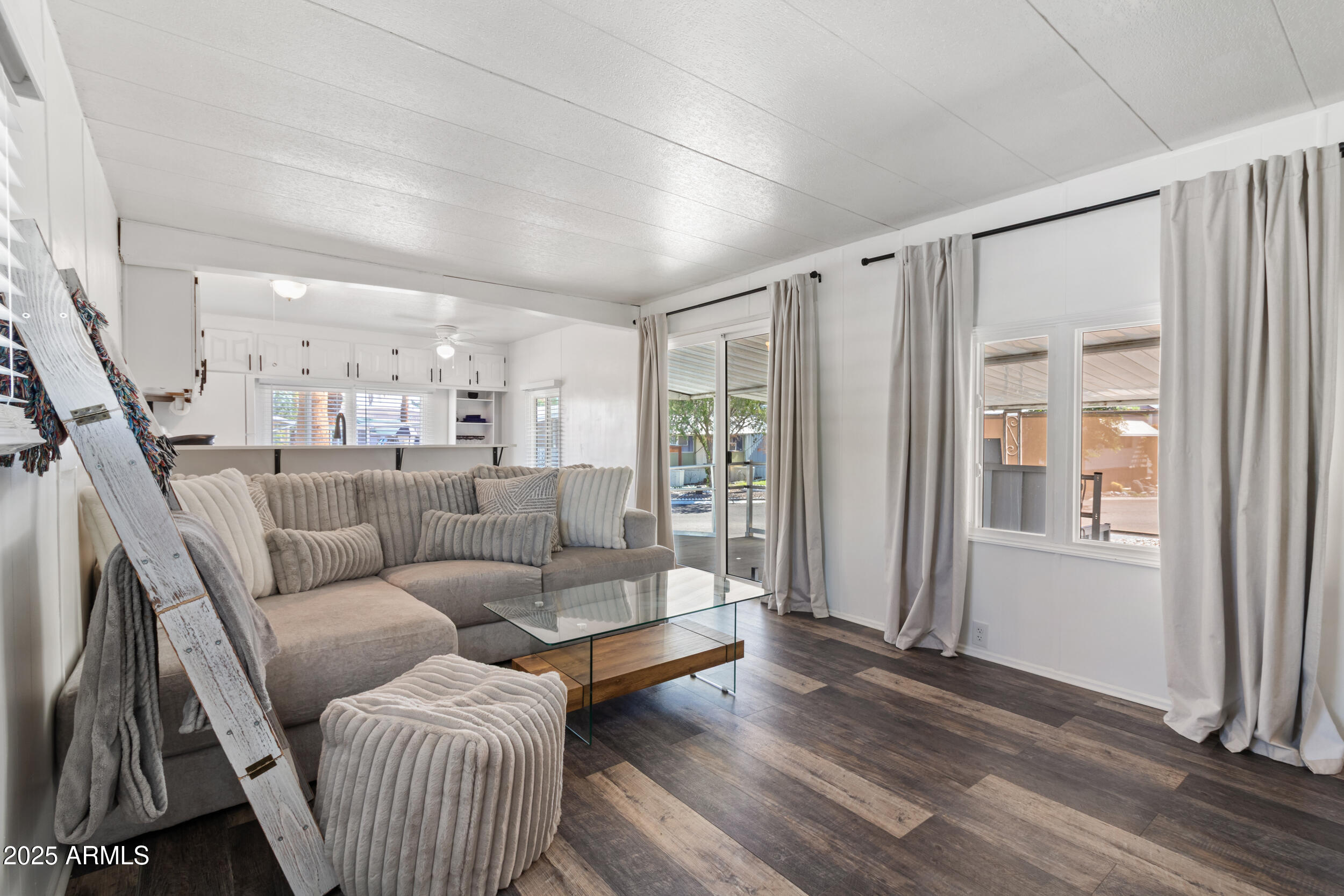 701 South Dobson Road, Unit 357 Mesa, AZ 85202 - Photo 5 of 66 a living room with furniture and a wooden floor