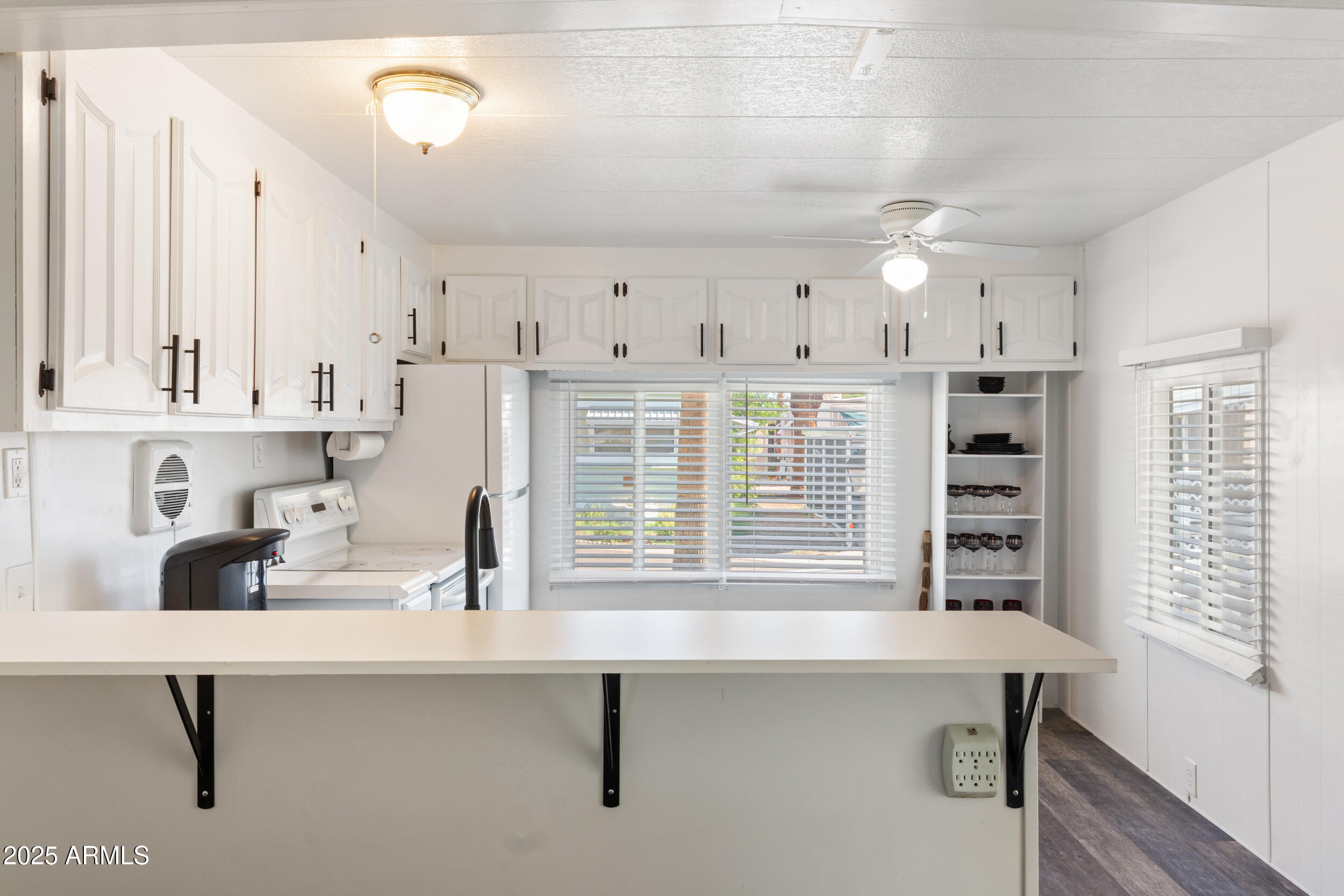 701 South Dobson Road, Unit 357 Mesa, AZ 85202 - Photo 6 of 66 a kitchen with a sink cabinets and window