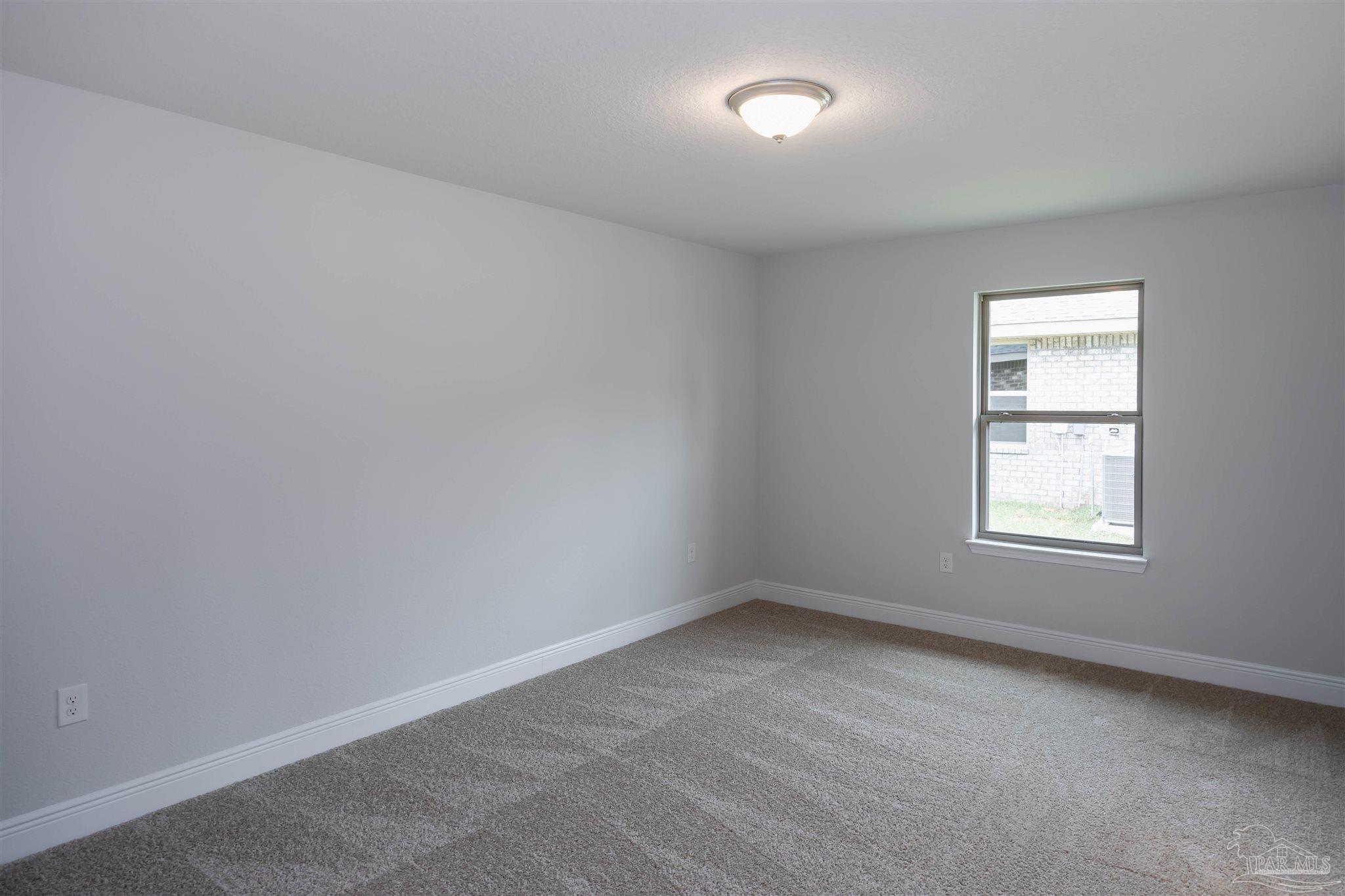 6288 Pineapple Drive Milton, FL 32570 - Photo 13 of 32 an empty room with a window