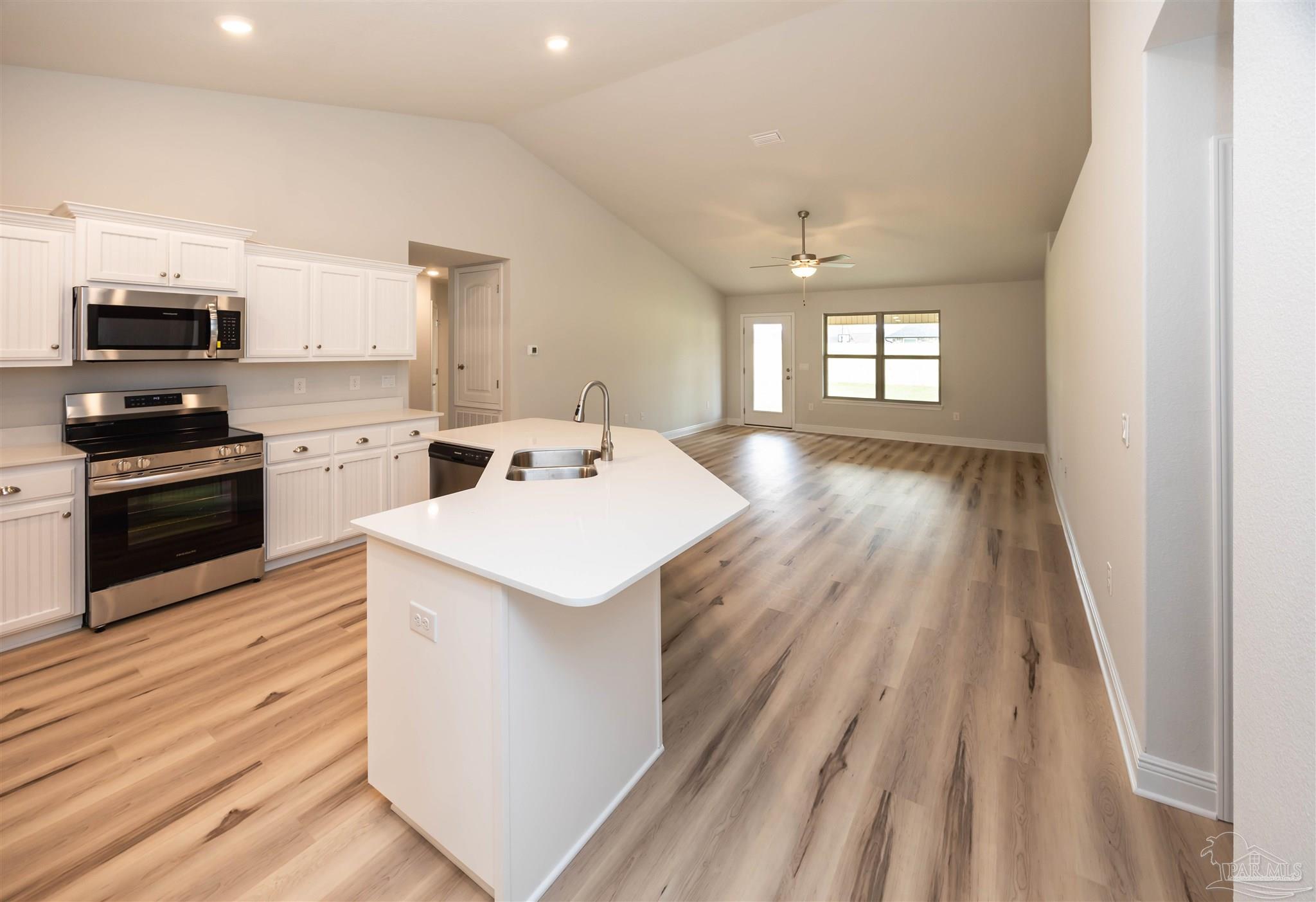 6288 Pineapple Drive Milton, FL 32570 - Photo 15 of 32 a kitchen that has a sink and a stove top oven