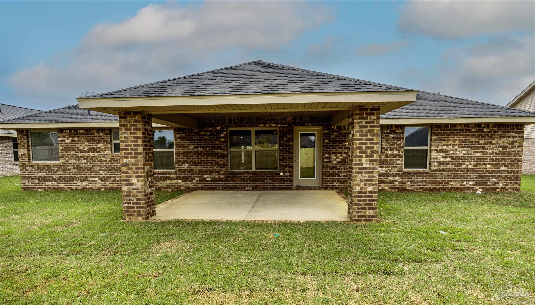 6288 Pineapple Drive Milton, FL 32570 - Photo 2 of 32 a view of a house with swimming pool and porch