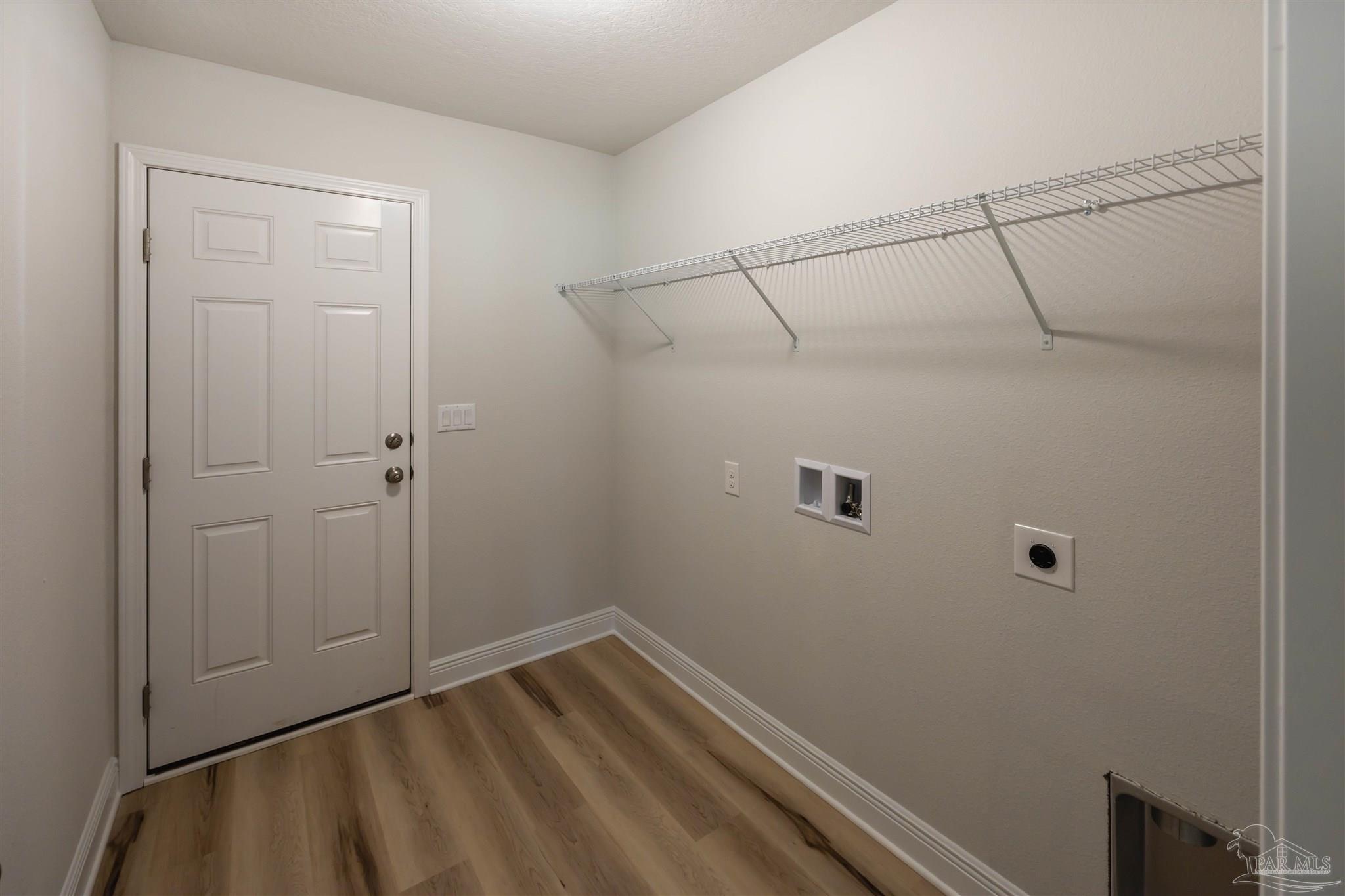 6288 Pineapple Drive Milton, FL 32570 - Photo 24 of 32 a view of a room with wooden floor