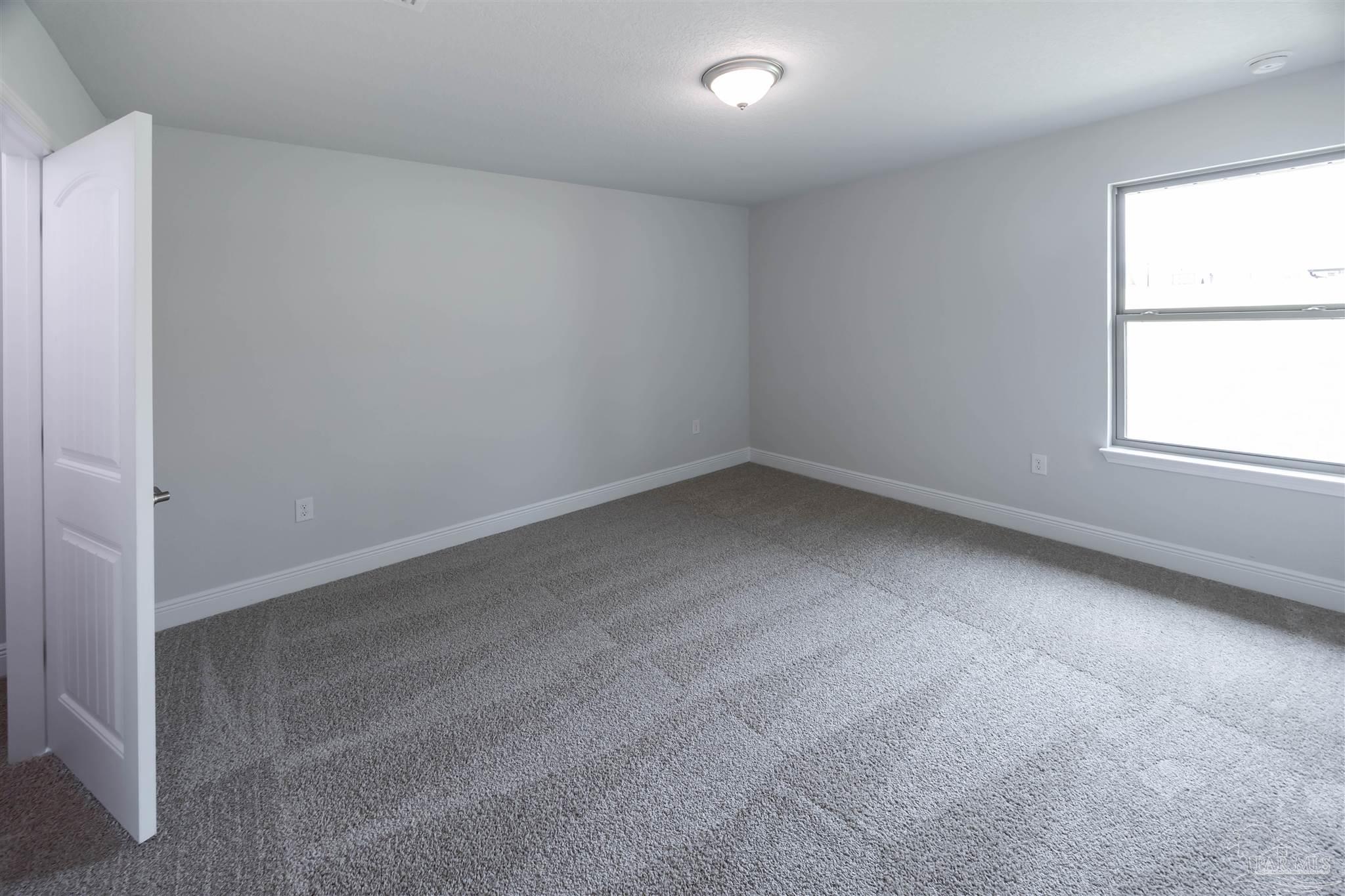 6288 Pineapple Drive Milton, FL 32570 - Photo 27 of 32 an empty room with a window
