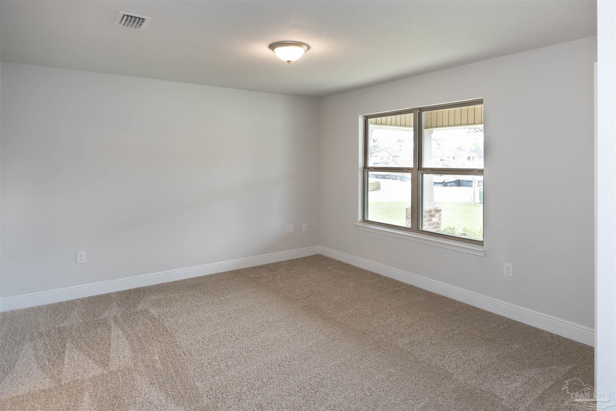 6288 Pineapple Drive Milton, FL 32570 - Photo 8 of 32 an empty room with a window