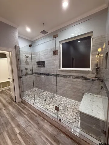 a bathroom with a shower and a sink