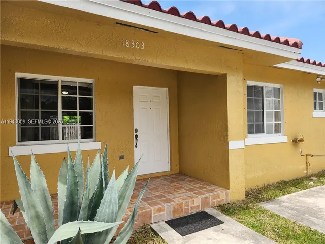 a front view of a house with outdoor space
