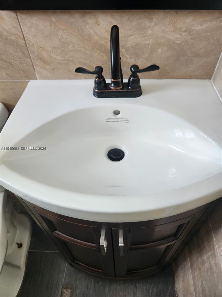 18303 Southwest 139th Place Miami, FL 33177 - Photo 13 of 19 a close view of sink and tap