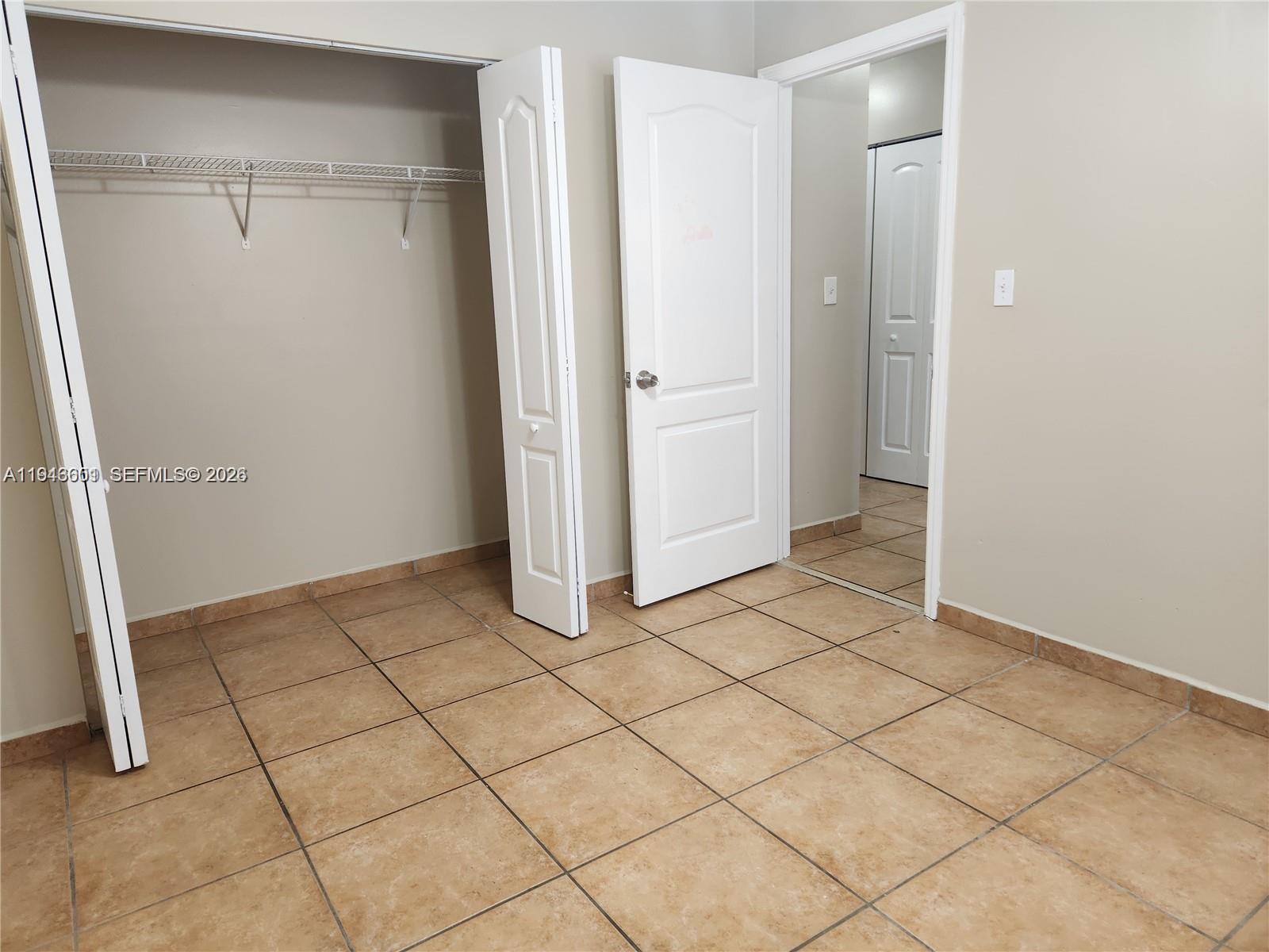18303 Southwest 139th Place Miami, FL 33177 - Photo 14 of 19 a view of a utility room with cabinet