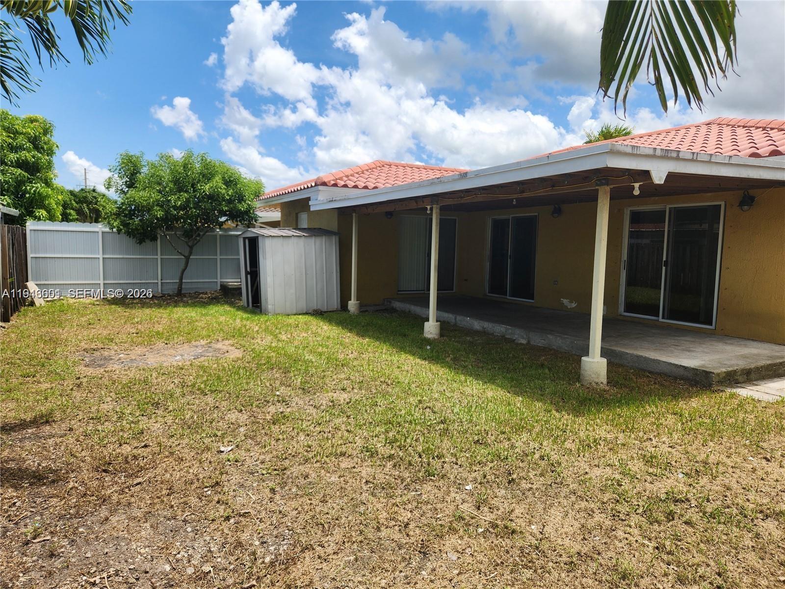 18303 Southwest 139th Place Miami, FL 33177 - Photo 19 of 19 a view of a house with a patio