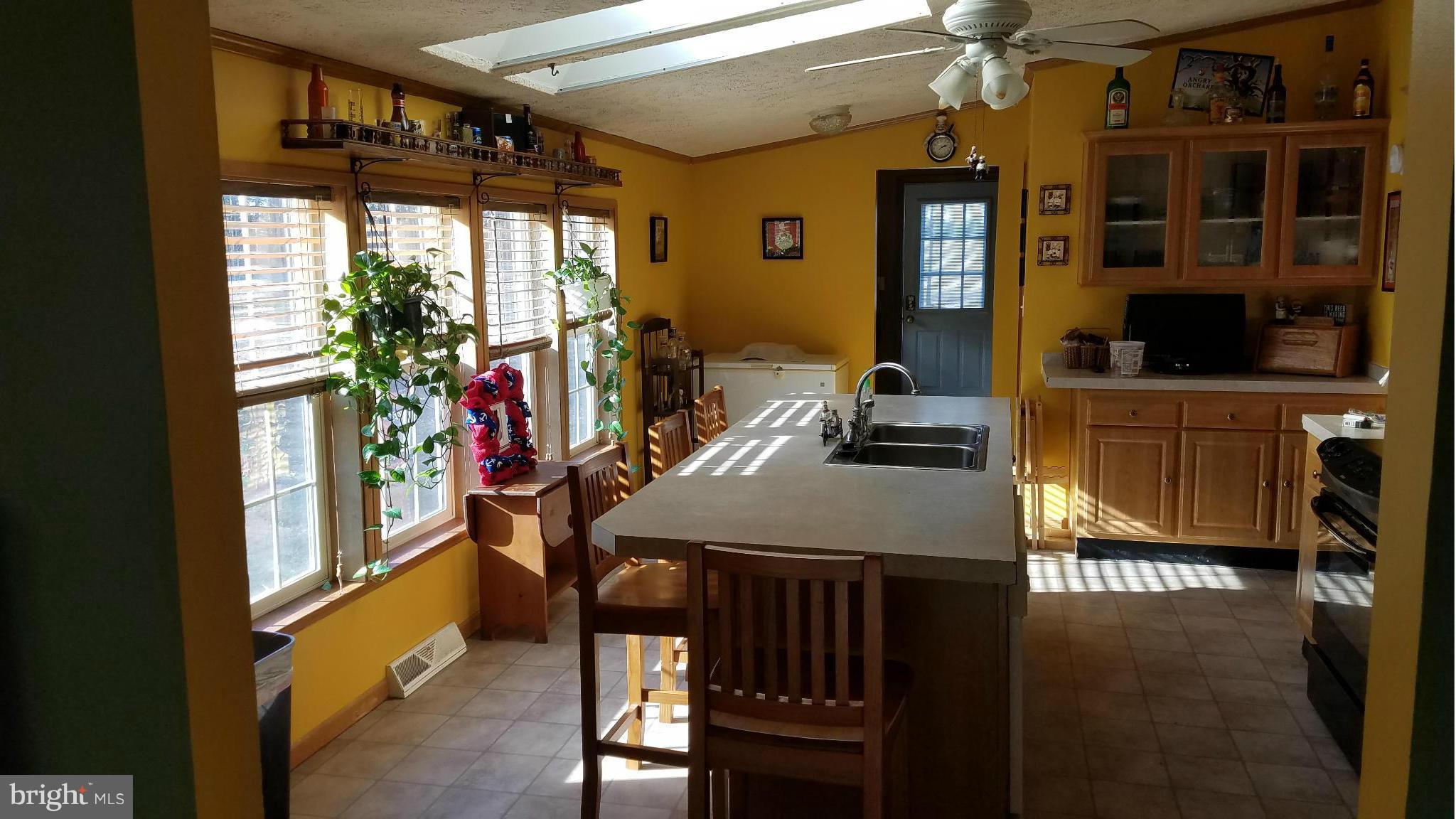 5712 Church Home Road Rhodesdale, MD 21659 - Photo 6 of 15 a dining room with furniture and window