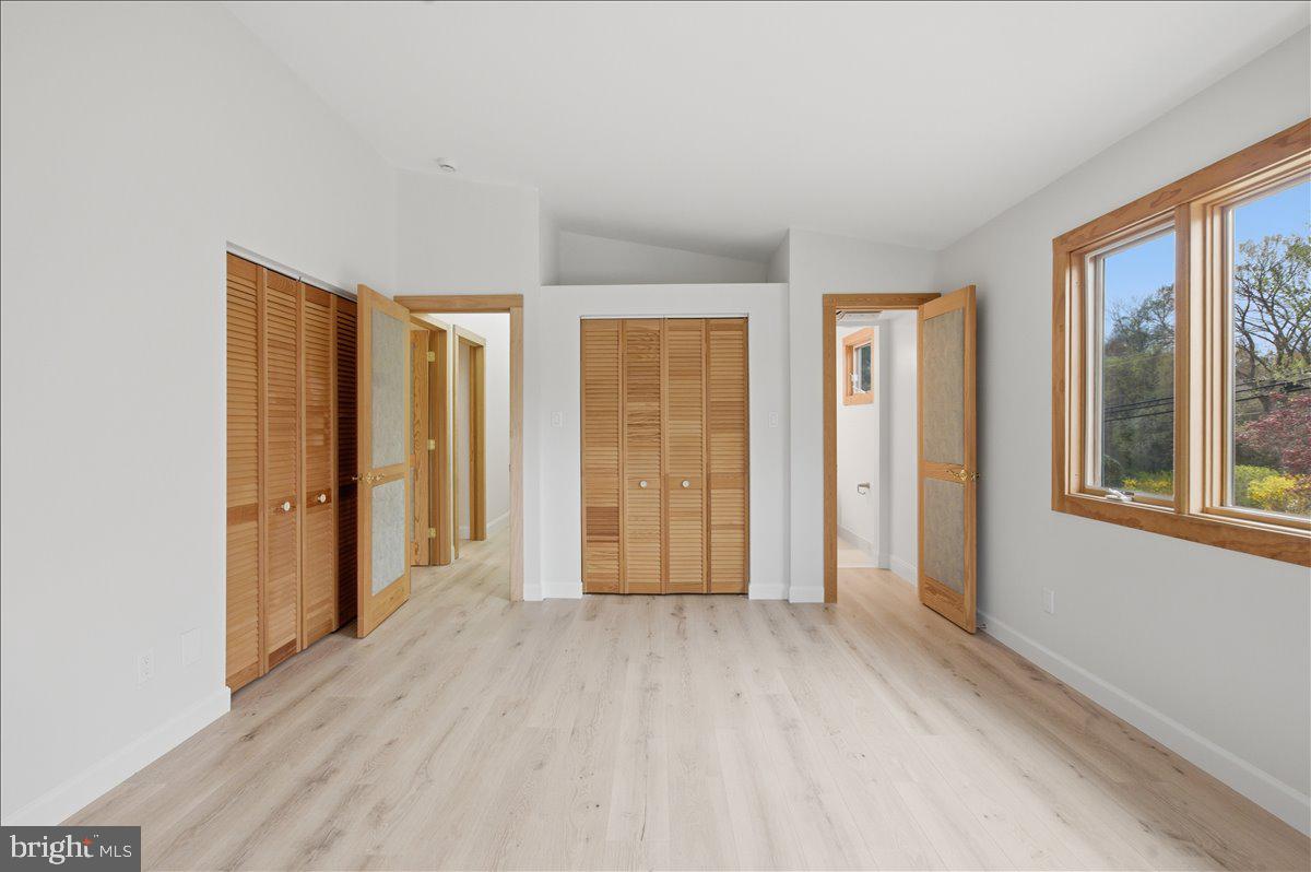 822 Walker Road Great Falls, VA 22066 - Photo 14 of 32 wooden floor in an empty room with a window