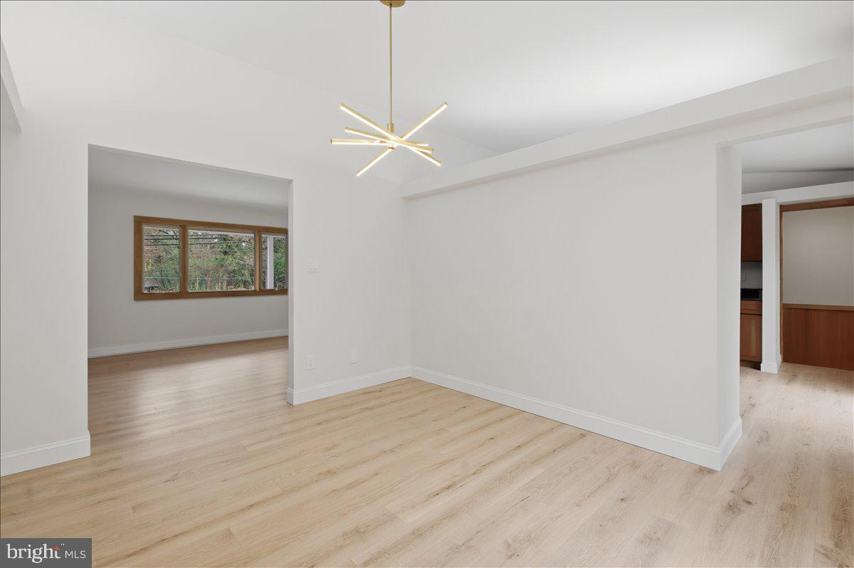 822 Walker Road Great Falls, VA 22066 - Photo 20 of 32 wooden floor in an empty room with a window