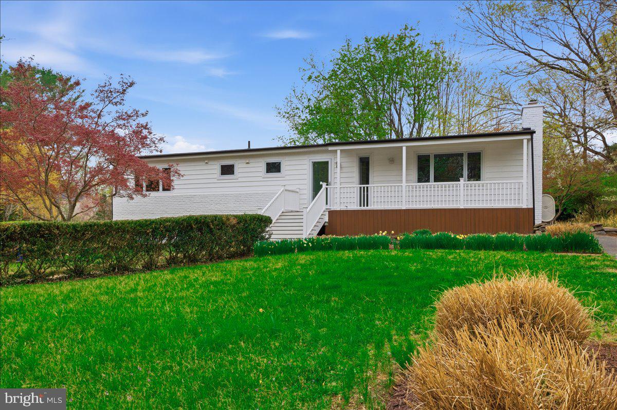 822 Walker Road Great Falls, VA 22066 - Photo 2 of 32 a house view with a garden space