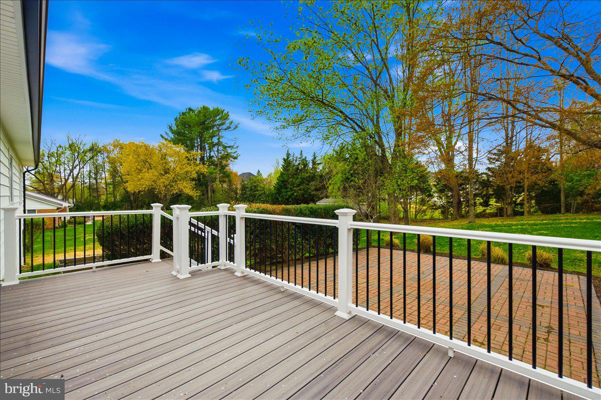 822 Walker Road Great Falls, VA 22066 - Photo 28 of 32 a balcony with wooden floor and fence