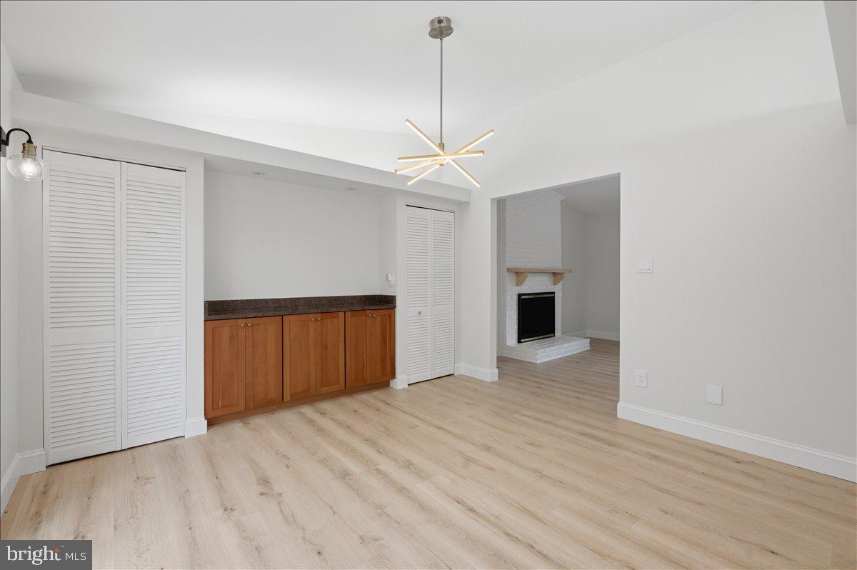 822 Walker Road Great Falls, VA 22066 - Photo 9 of 32 a view of empty room with wooden floor and fan
