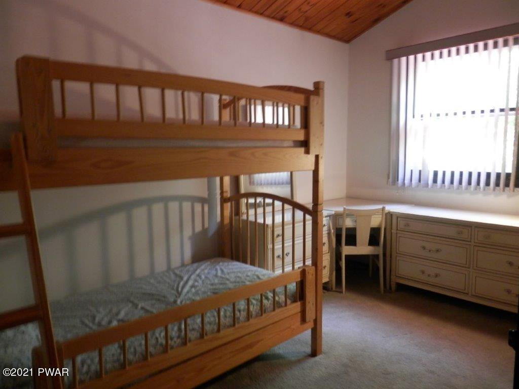112 Squirrel Road Dingmans Ferry, PA 18328 - Photo 12 of 26 a view of a bedroom with furniture