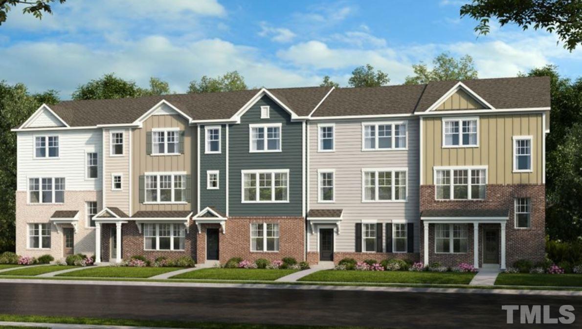 6928 Leesville Road, Unit 5 Raleigh, NC 27613 - Photo 11 of 16 a front view of residential houses with yard