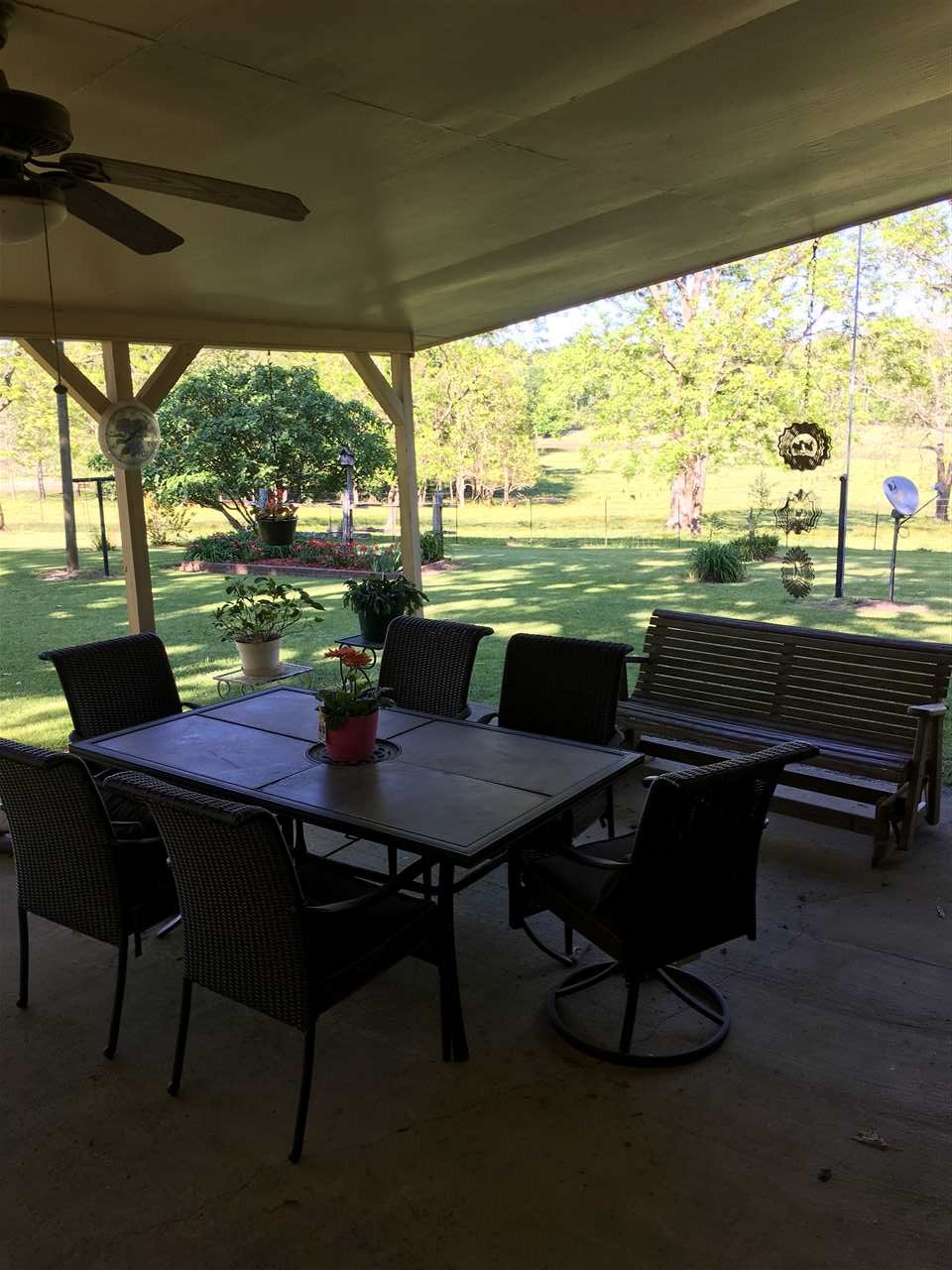 20 Butler Lane Collins, MS 39428 - Photo 11 of 24 a view of a dining room with furniture window and outside view