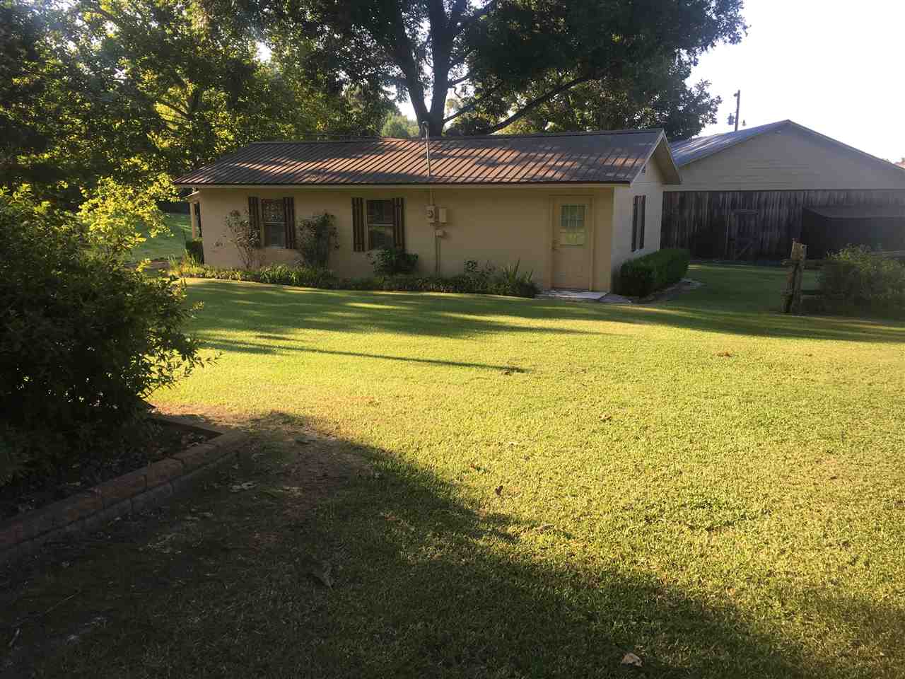 20 Butler Lane Collins, MS 39428 - Photo 12 of 24 a view of house with backyard and outdoor seating