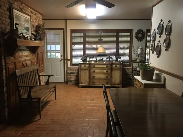 a kitchen with lots of counter top space and furniture