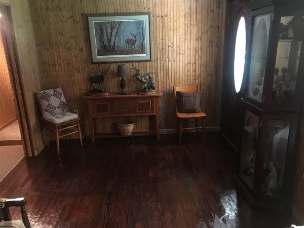 a room with furniture and wooden floor