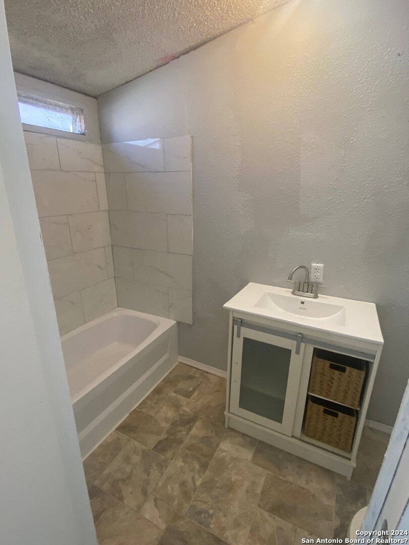 1311 Hein Road West, Unit 19 San Antonio, TX 78220 - Photo 7 of 8 a utility room with a sink dryer and washer