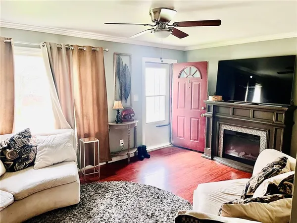 a living room with furniture and a fireplace