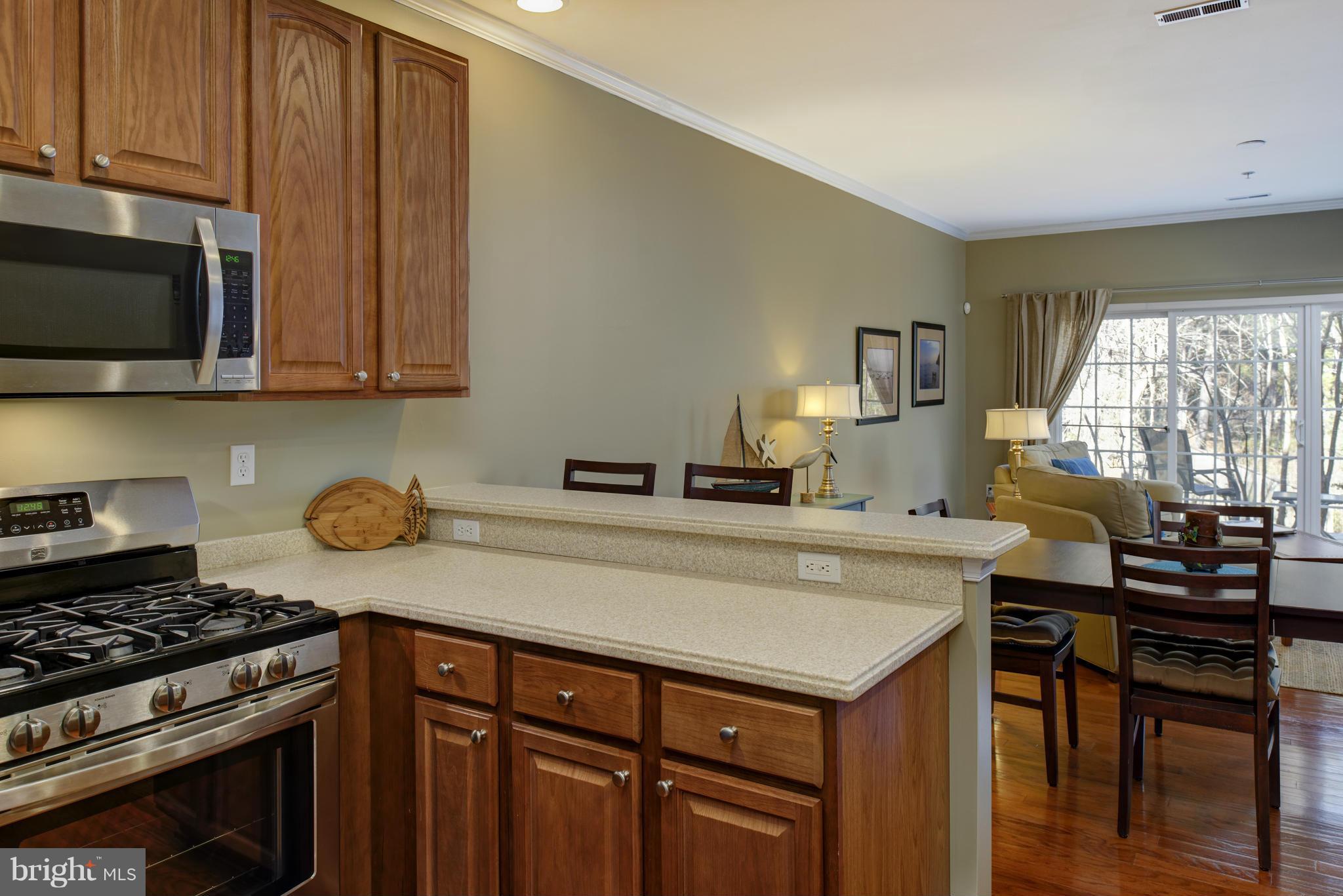 682 Ruxton Road, Unit 65 Dowell, MD 20629 - Photo 12 of 30 The 2nd kitchen seating peninsula