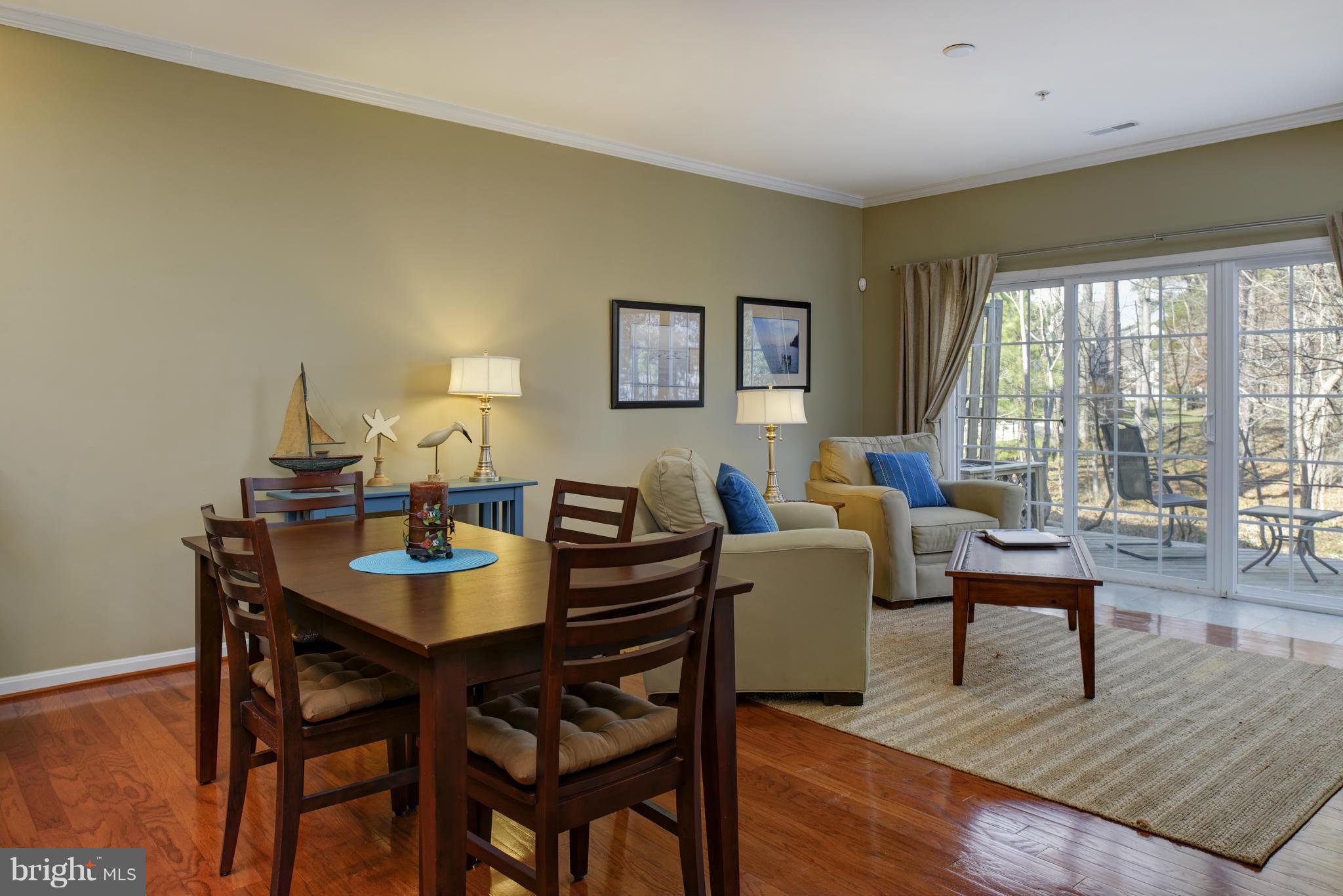 682 Ruxton Road, Unit 65 Dowell, MD 20629 - Photo 13 of 30 DR with hardwood flooring and nature views