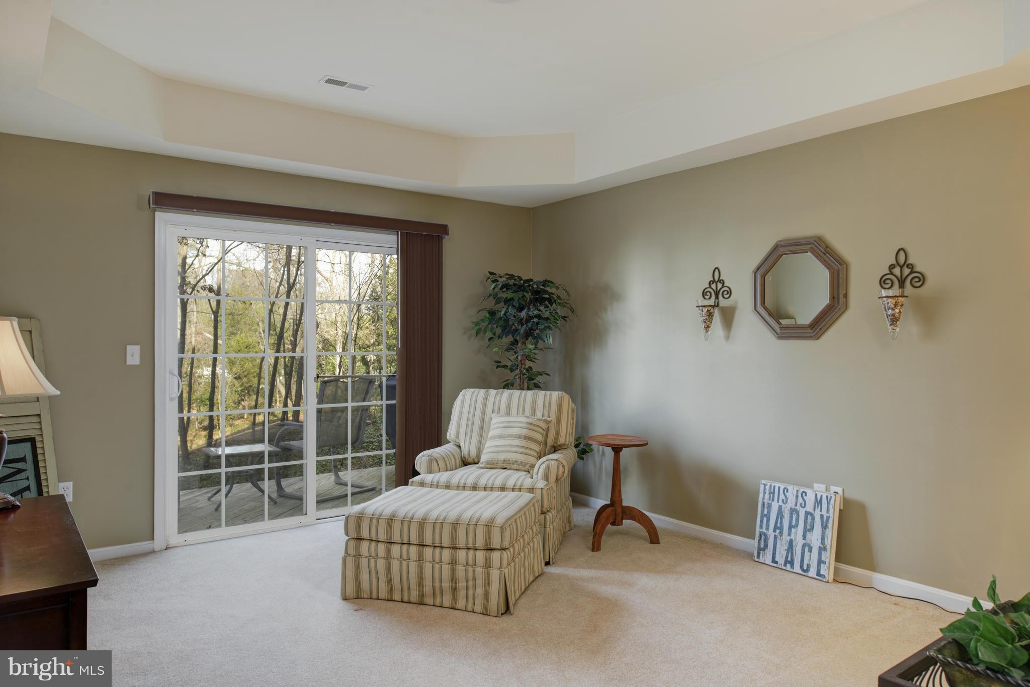 682 Ruxton Road, Unit 65 Dowell, MD 20629 - Photo 14 of 30 1st floor light filled MBR with deck access