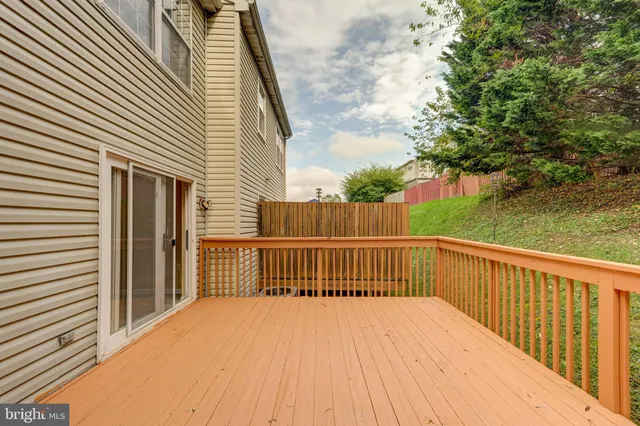 a balcony with wooden floor