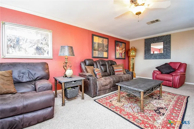 a view of a kitchen counter space and wooden floor