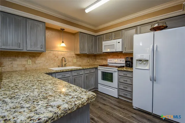 a bathroom with a shower curtain and a toilet