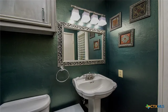 a view of a garage with rack and bicycle