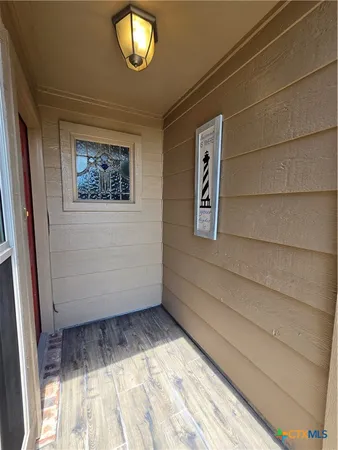 a view of an empty room and window