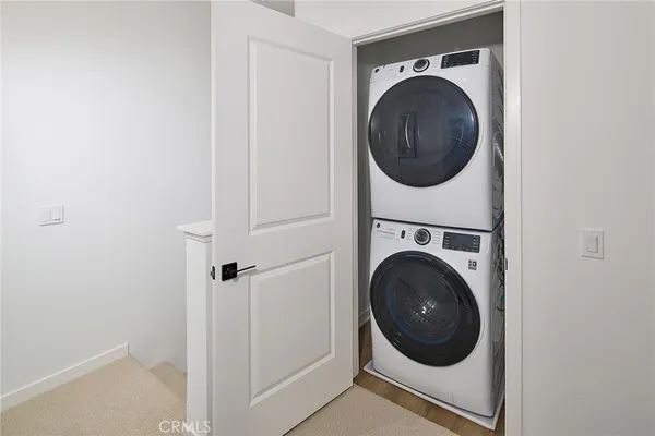 a close up view of a washer and dryer in a utility room