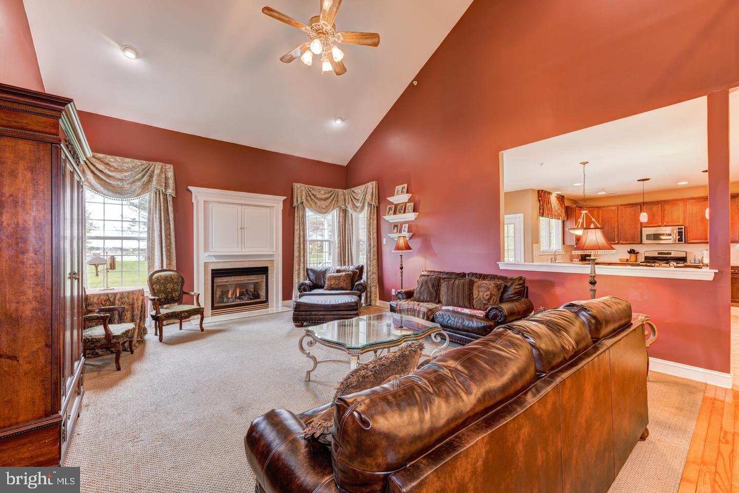 2147 Brookshire Road Furlong, PA 18925 - Photo 13 of 39 a living room with furniture a fireplace and a flat screen tv