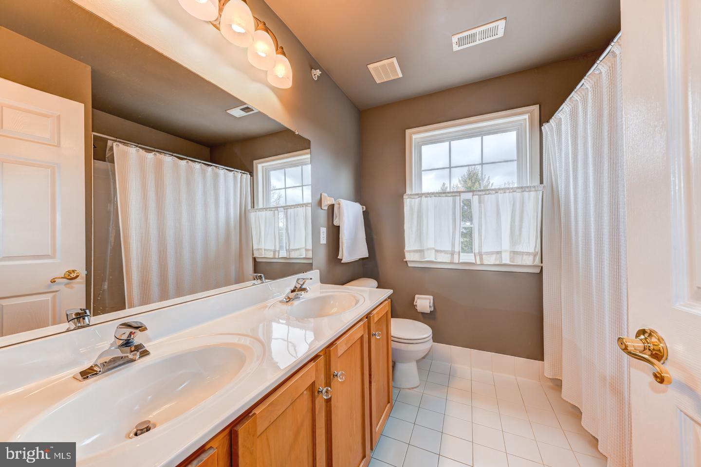 2147 Brookshire Road Furlong, PA 18925 - Photo 27 of 39 a spacious bathroom with a tub sink and mirror
