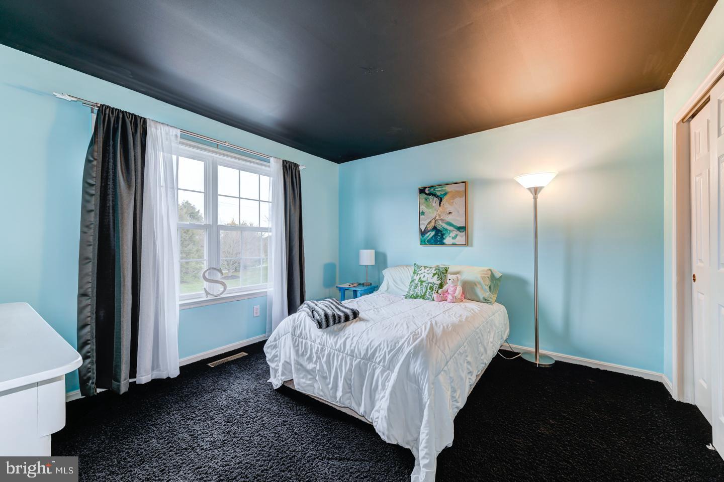 2147 Brookshire Road Furlong, PA 18925 - Photo 28 of 39 a bedroom with a bed and a window