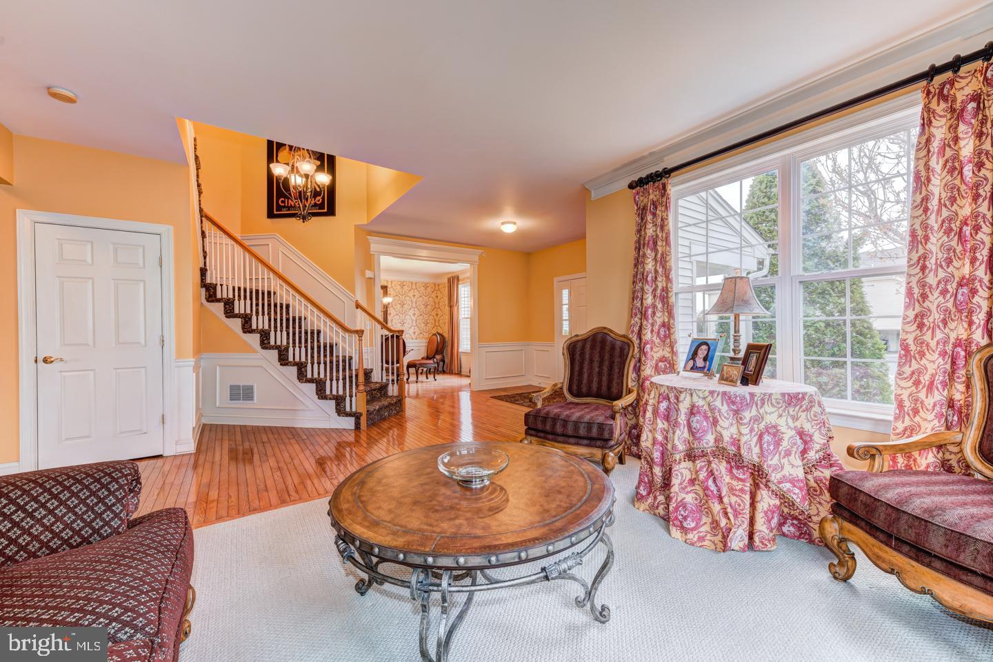 2147 Brookshire Road Furlong, PA 18925 - Photo 6 of 39 a living room with furniture and a chandelier