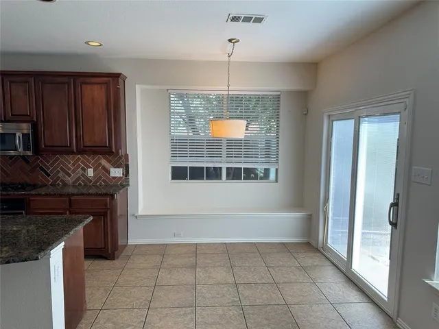 a kitchen with a stove a sink and a refrigerator