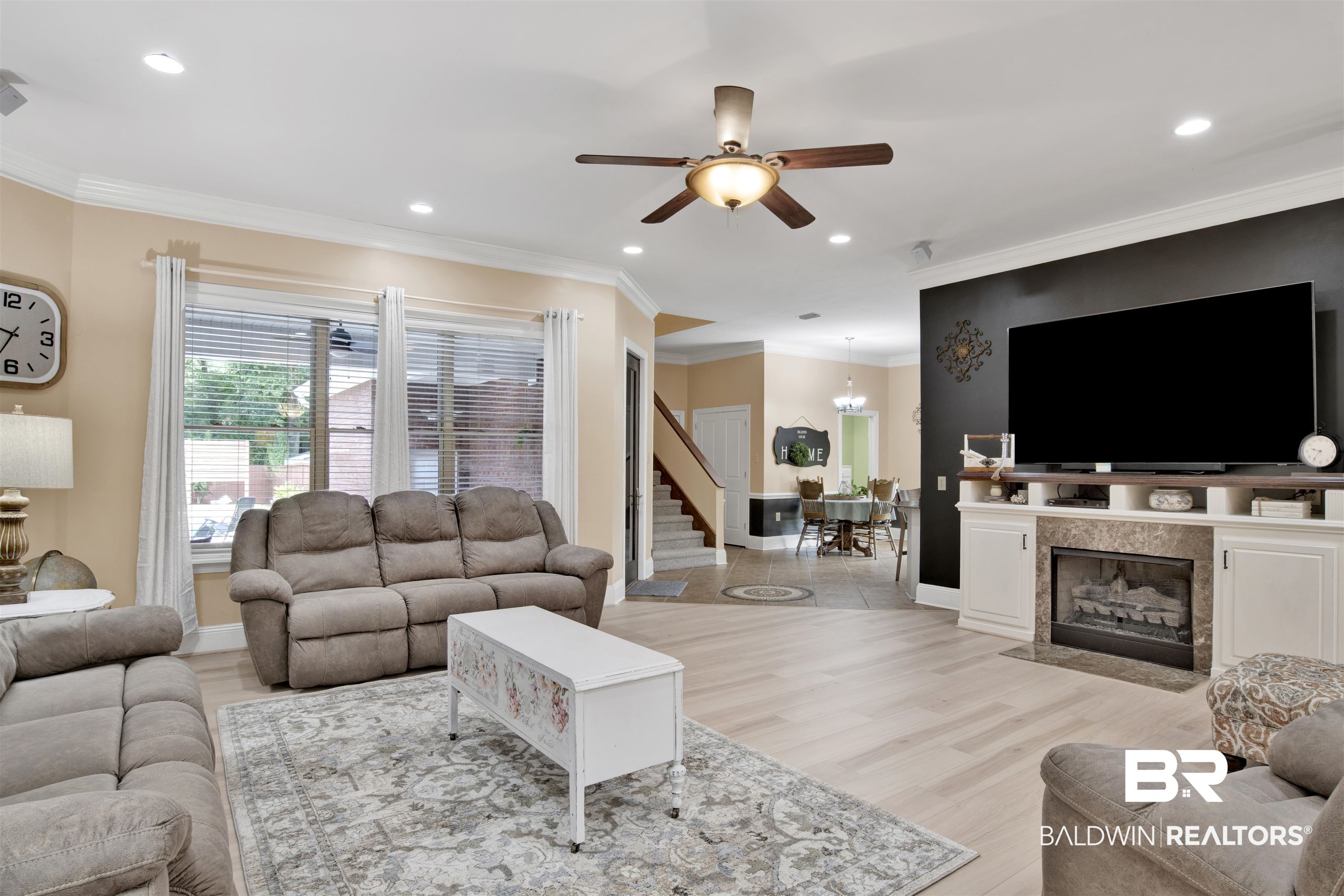 4340 Hamilton Oaks Lane Mobile, AL 36695 - Photo 4 of 51 Living room with ceiling fan, light hardwood / wood-style flooring, a fireplace, and crown molding