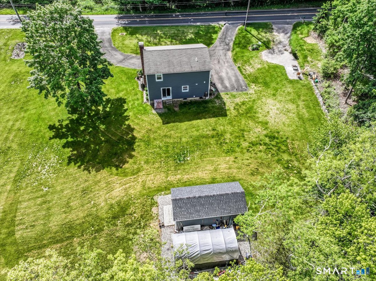 19 Botsford Hill Road Newtown, CT 06470 - Photo 38 of 40 a backyard of a house with outdoor seating
